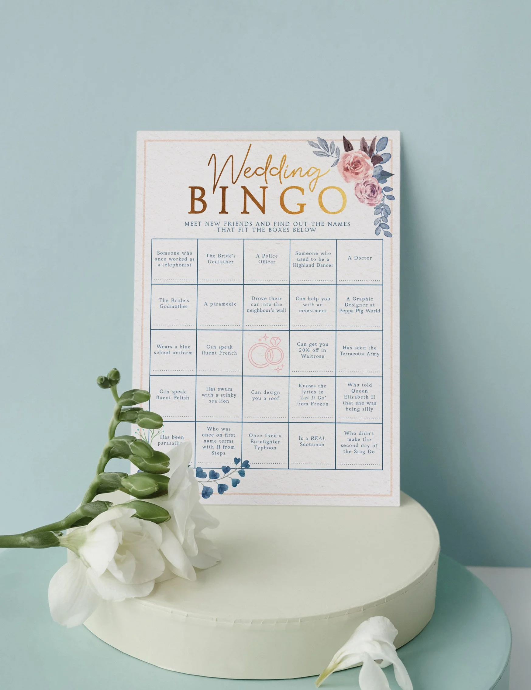 Wedding bingo sheet featuring floral design, gold lettering and bingo sheet for wedding guests.