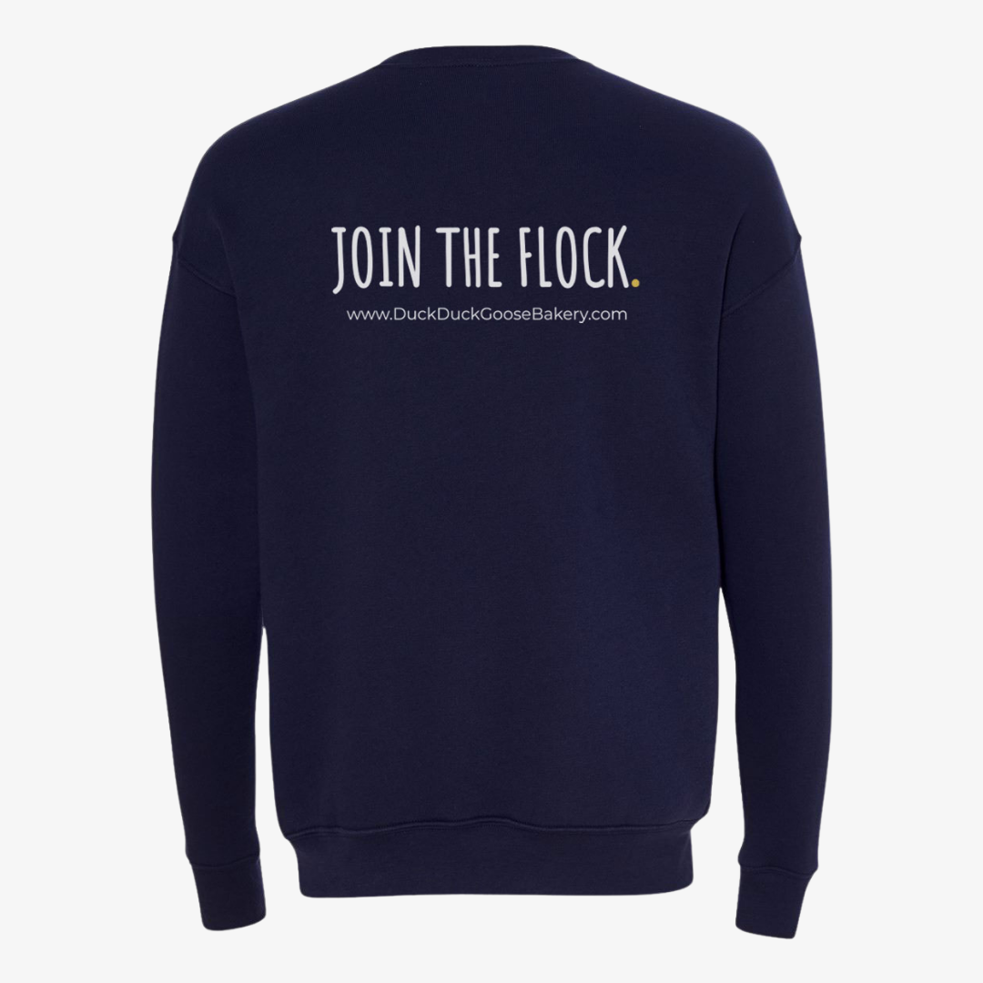 Duck Duck Goose Bakery crewneck with the duck logo in the middle.