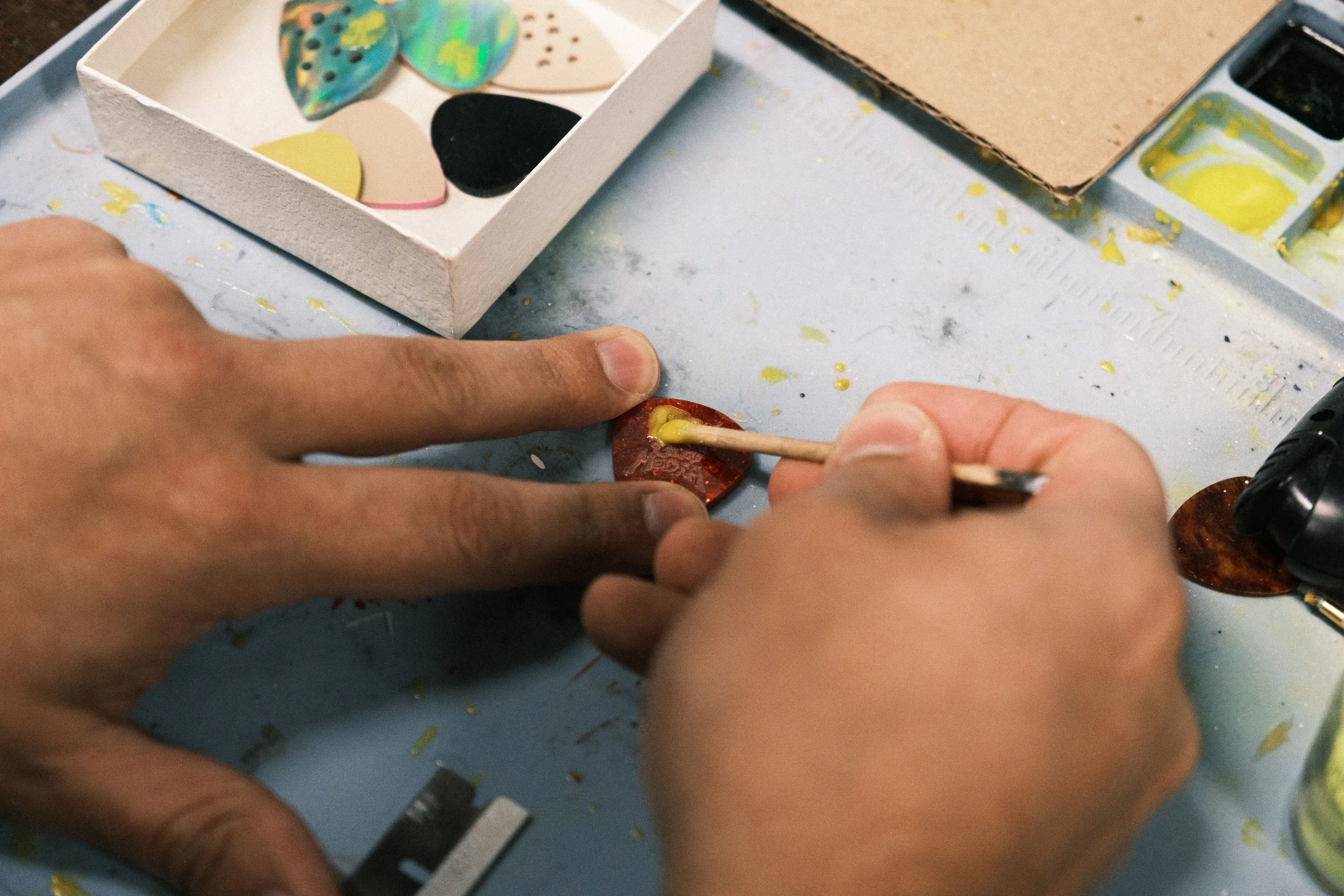   Applying the pigment to the logo.  