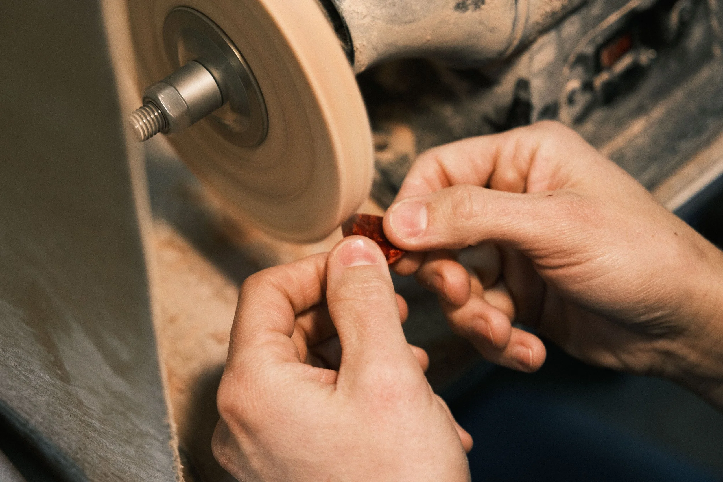   The last step is polishing the pick. This is Rick using a buffer with some polishing compound.  