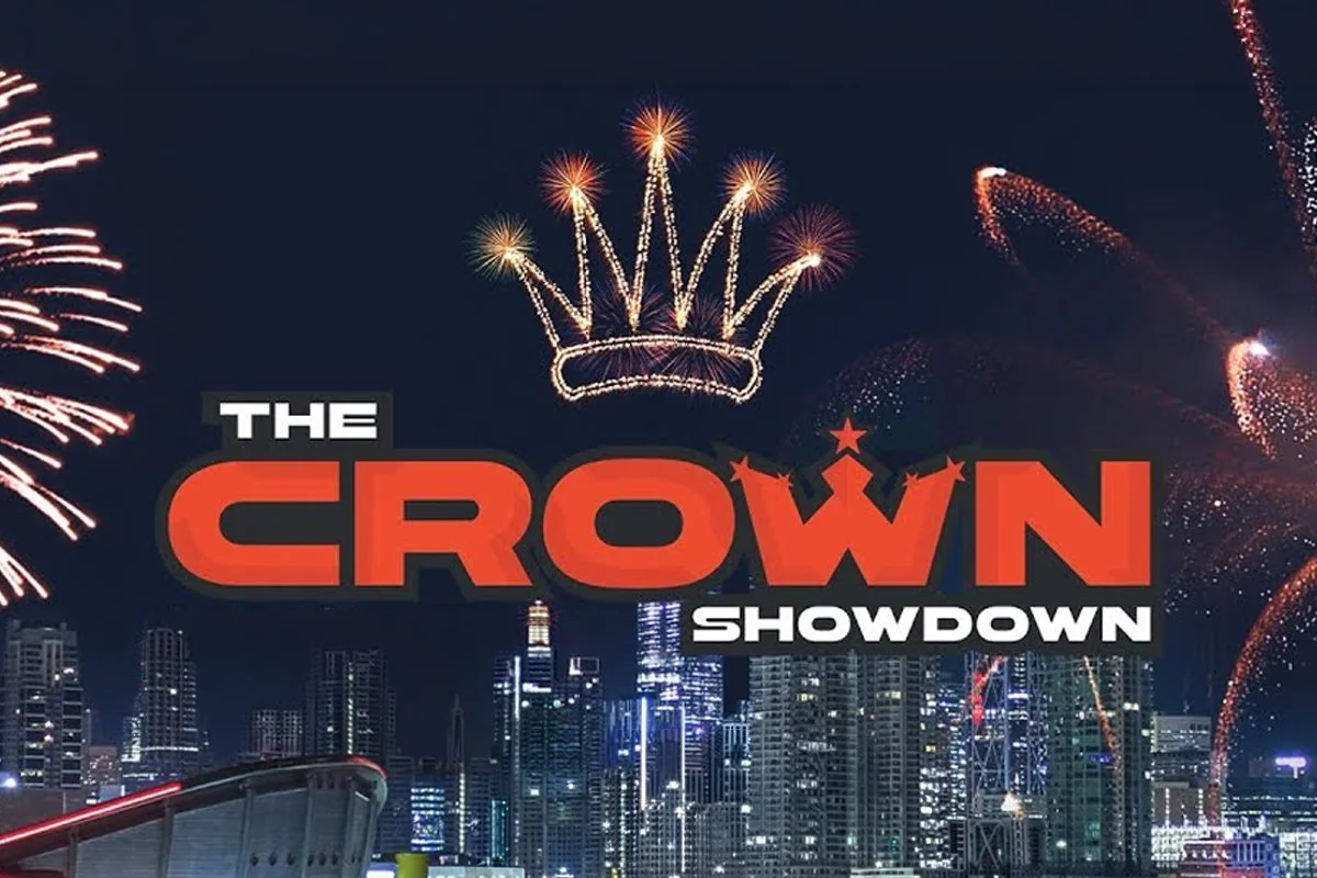 Fireworks display over a city skyline at night with the logo 'The Crown Showdown' in the foreground.