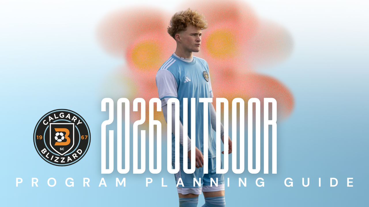 A young man in an Atlanta United FC soccer jersey stands outdoors with a blurred colorful background, holding a soccer ball.