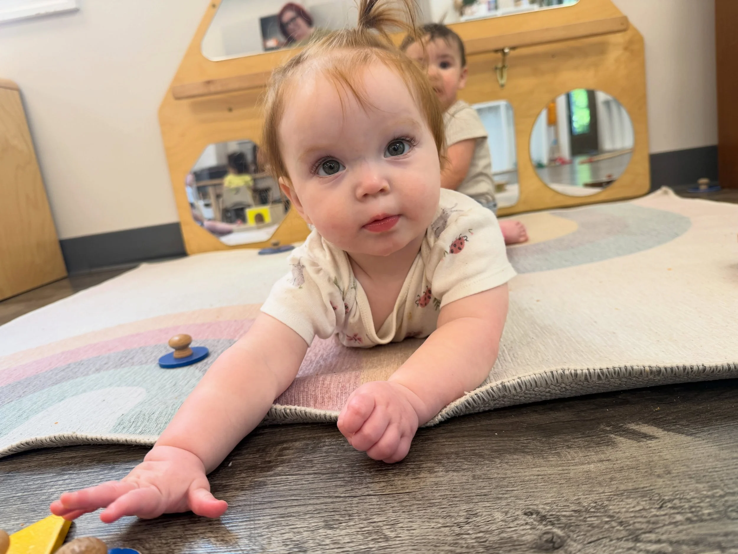 Even at the youngest ages, learning is already unfolding. 💛 Through tummy time and purposeful movement, infants begin building strength, coordination, confidence, and independence. In Montessori, we carefully prepare environments that meet each chil