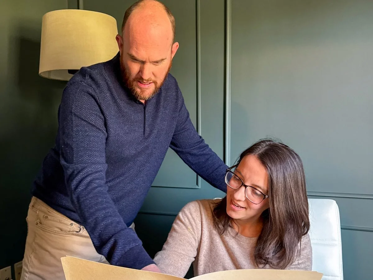 Dr. Niles Cook and Dr. Erin Cook of Red Elm Psychotherapy collaborating in their Vienna, VA therapy office.