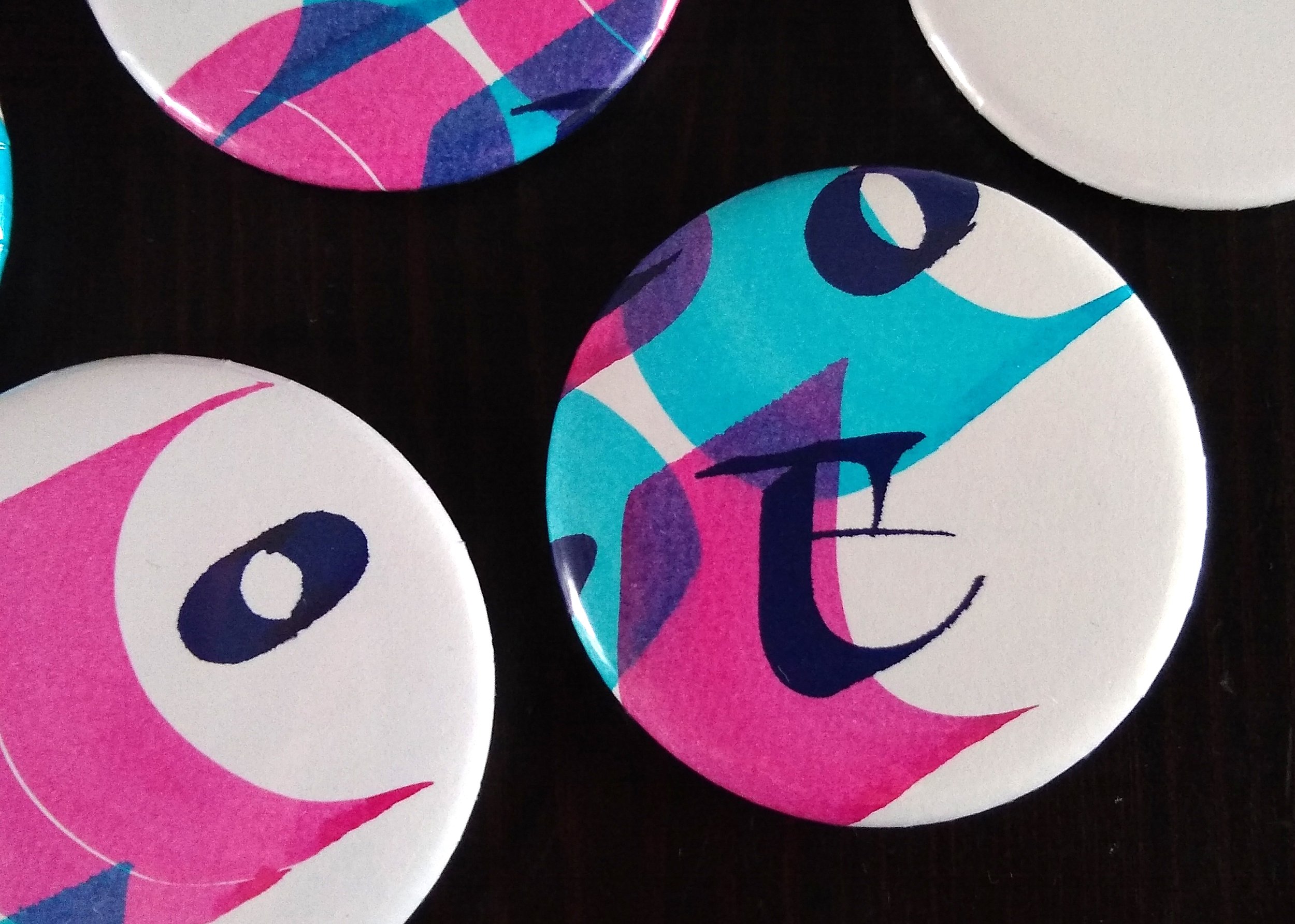 cmyk_badges_large.jpg