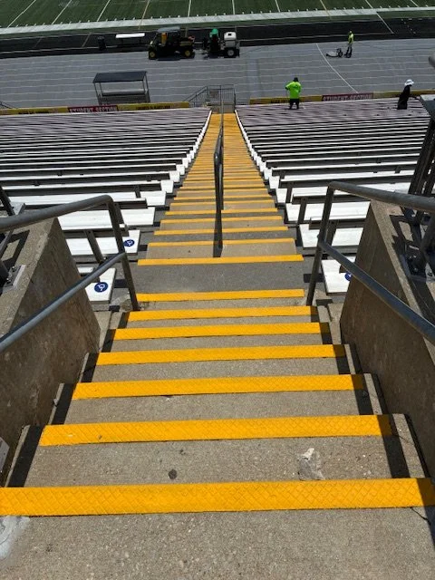bleach seats and steps freshly power washed at a football stadium