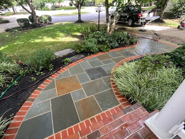 freshly cleaned brick paver walkway 