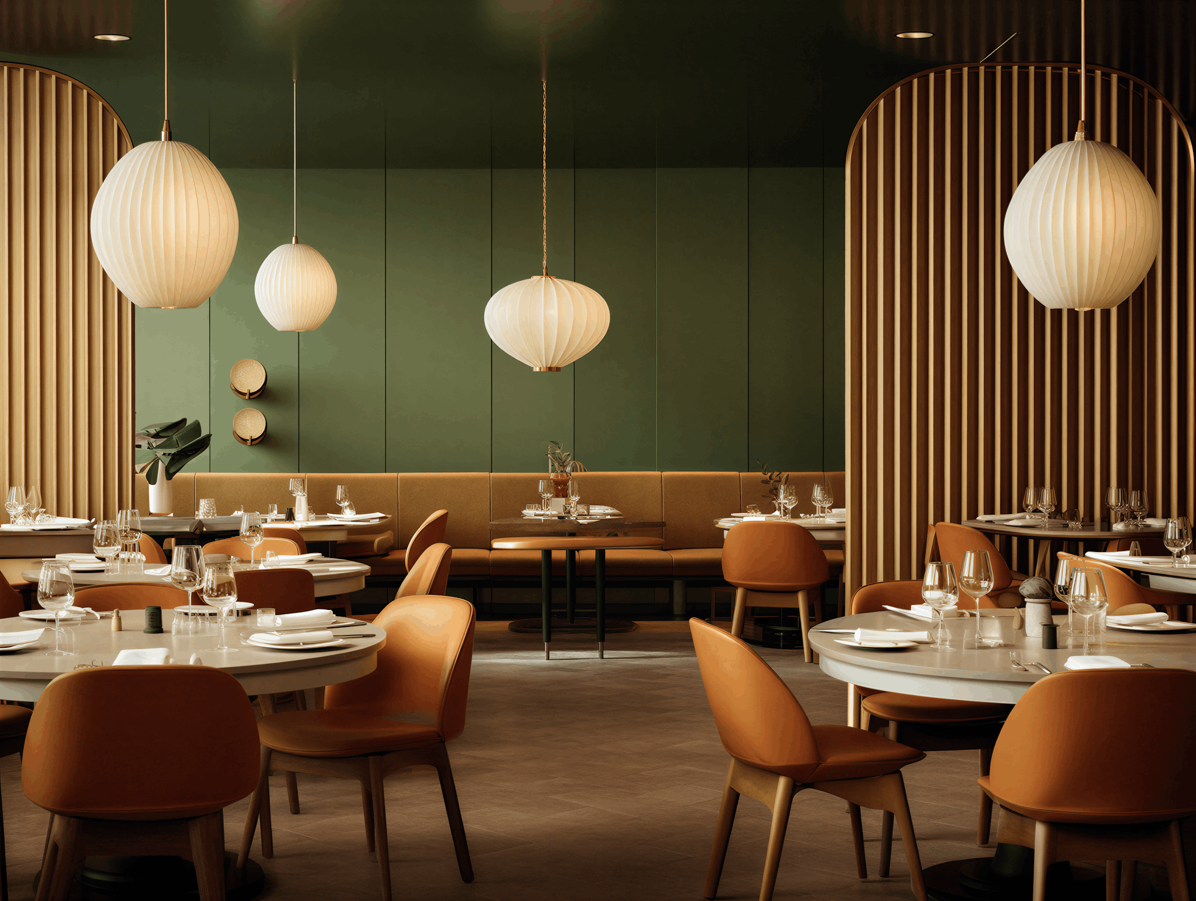 Elegant restaurant interior with round tables, orange chairs, white tableware, wine glasses, and pendant lights, with green walls and wooden accents.