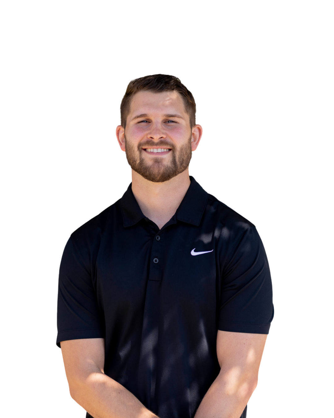 Portrait of a smiling man with a beard wearing a black Nike polo shirt, standing against a white background.