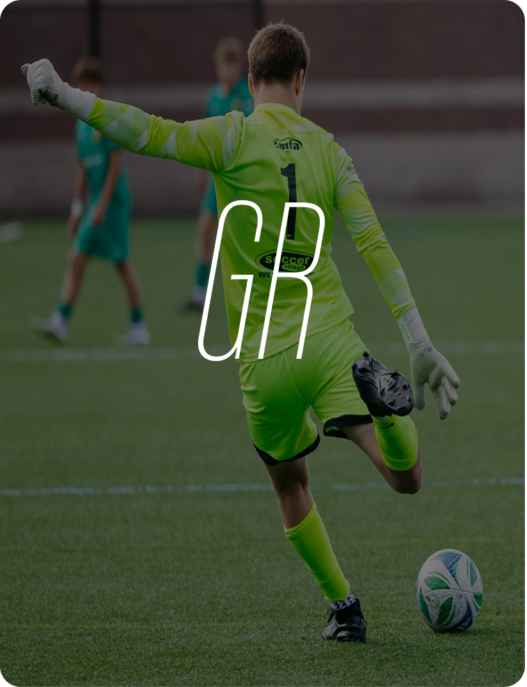 Soccer goalkeeper in bright yellow uniform kicking a soccer ball on the field during a match.