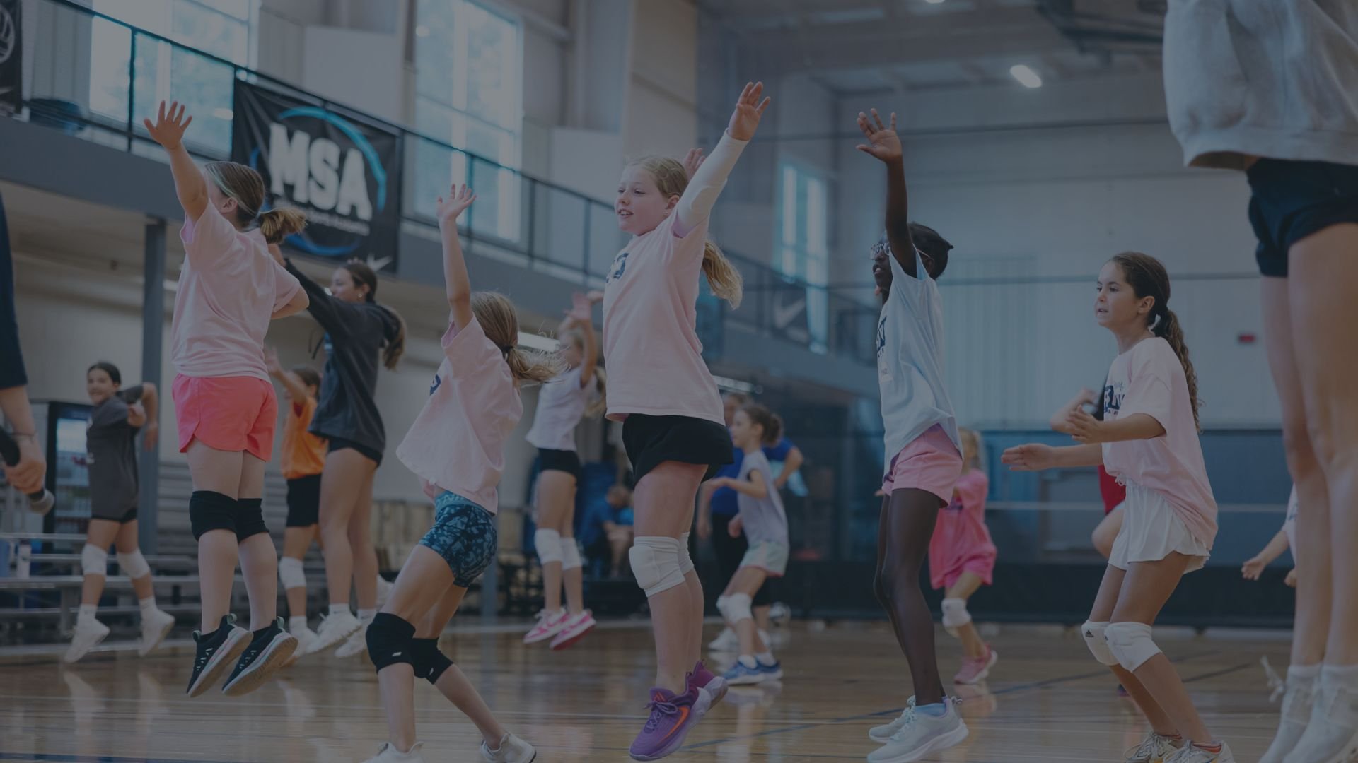 Children practicing volleyball