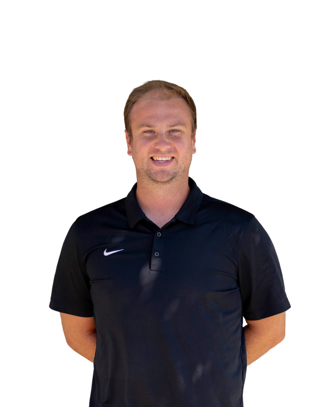 A man with short, light brown hair wearing a black Nike polo shirt, standing against a plain white background, smiling at the camera.