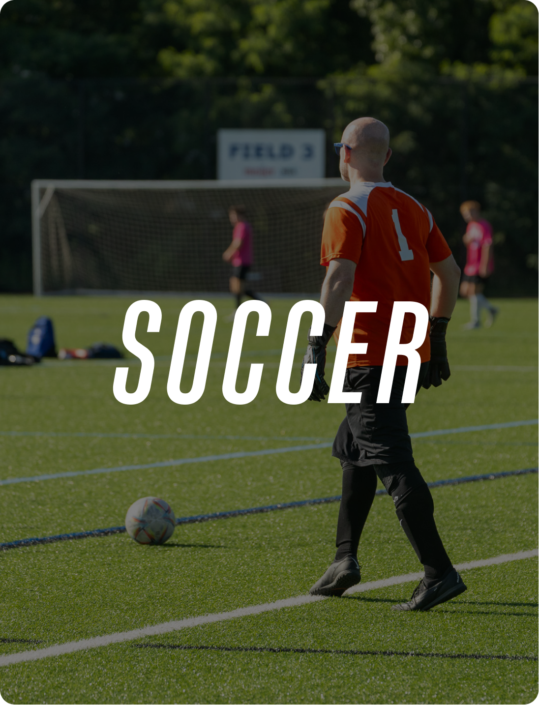 A soccer player standing on a field with a soccer ball nearby, with other players and a goal in the background, and the word 'SOCCER' across the image.
