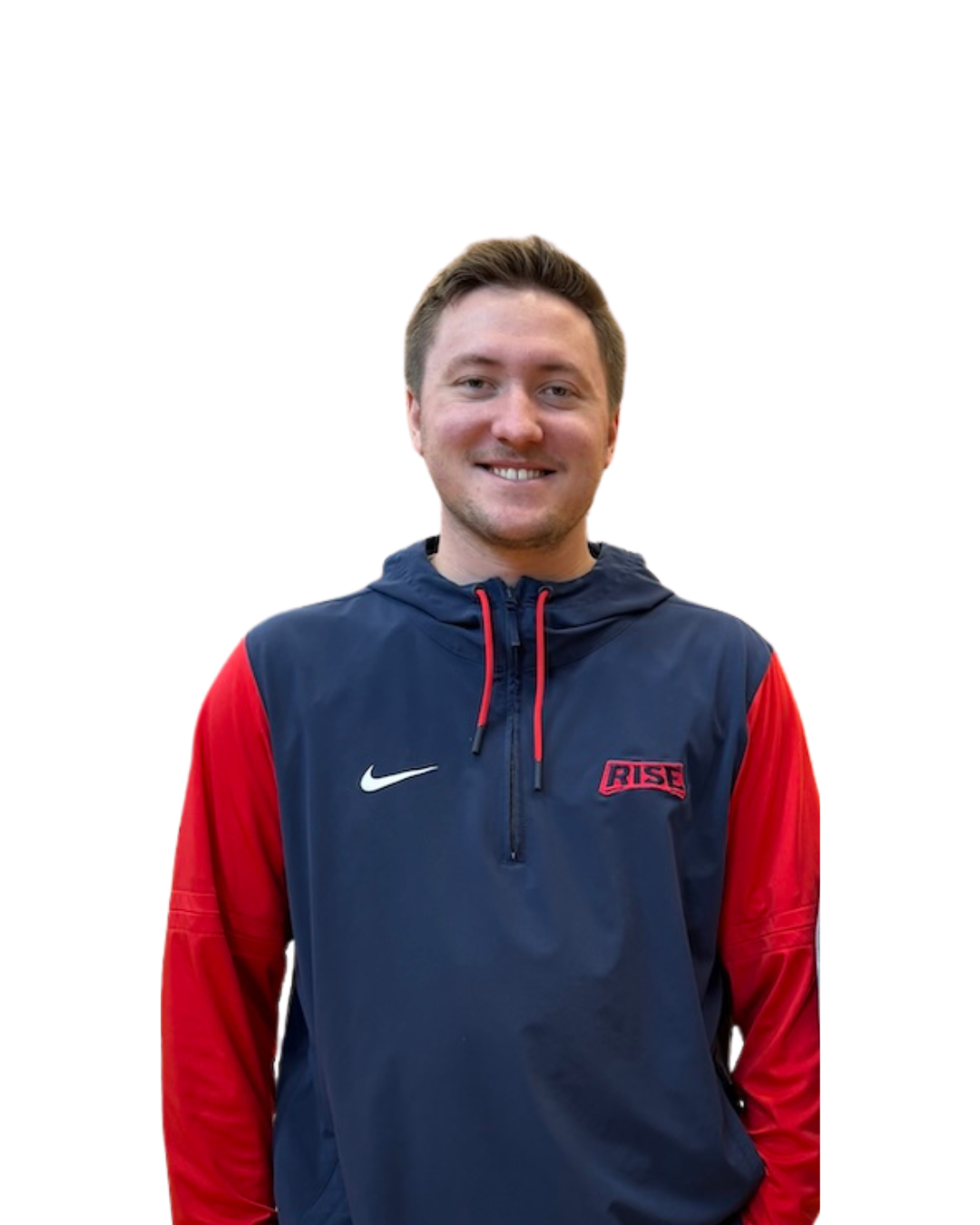 A smiling young man wearing a navy and red Nike athletic jacket with a hood, standing against a plain white background.