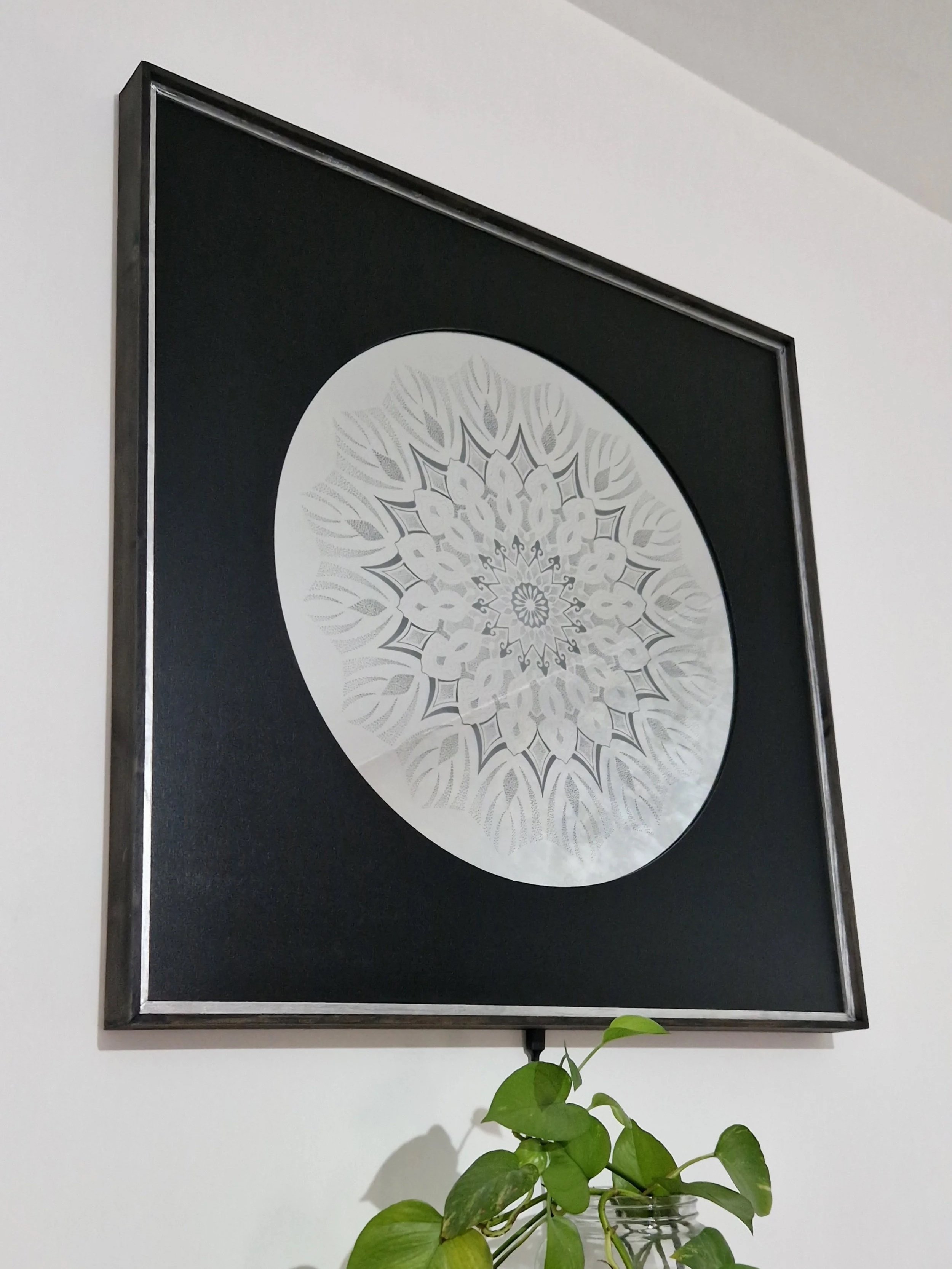 A MANDALA OF STILLNESS . This handcrafted engraved mirror combines intricate mandala with a soft LED illumination, creating a contemporary statement piece that radiates balance, depth, and tranquility.