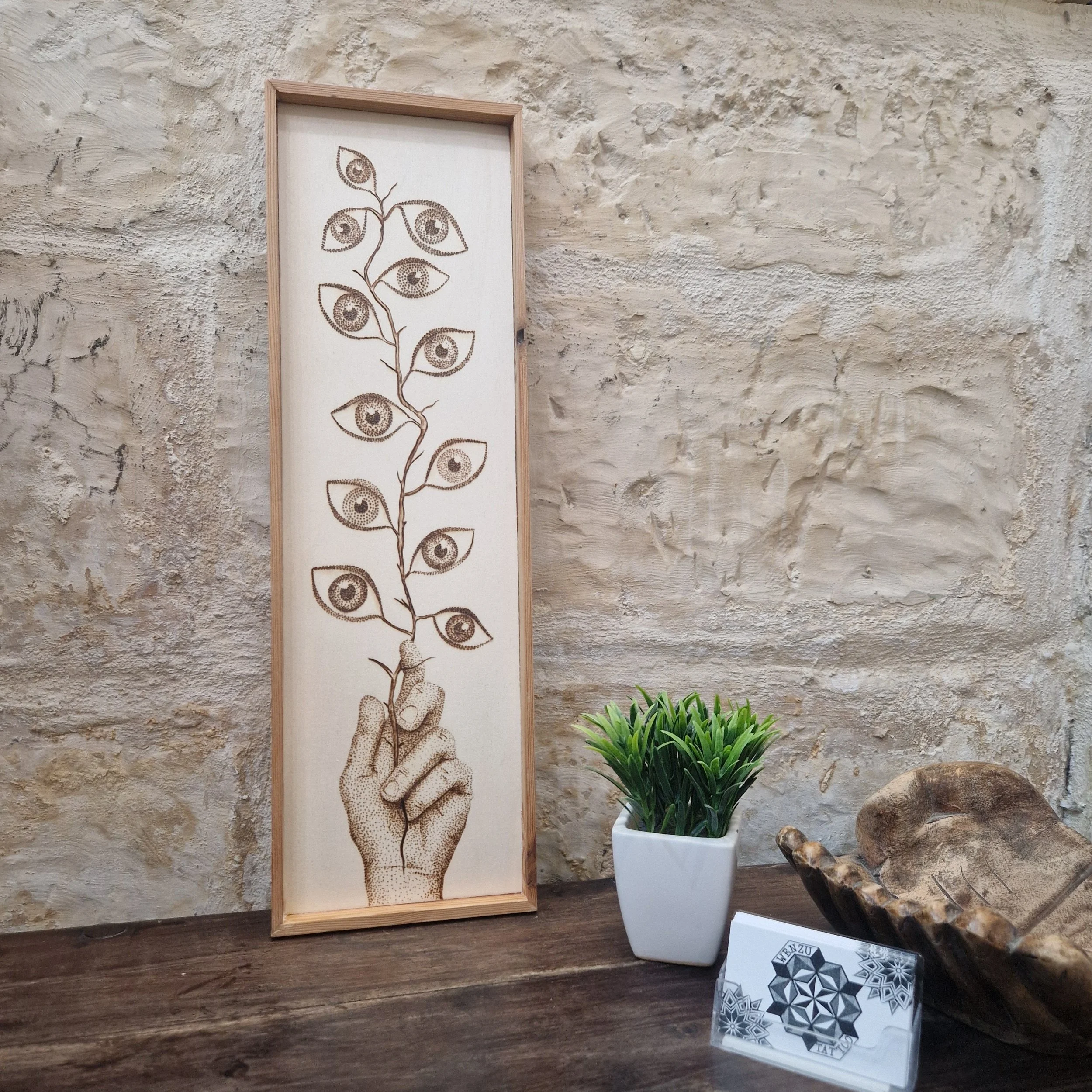 Branch of eyes 

Size 16cm x 53cm 
Wax finish