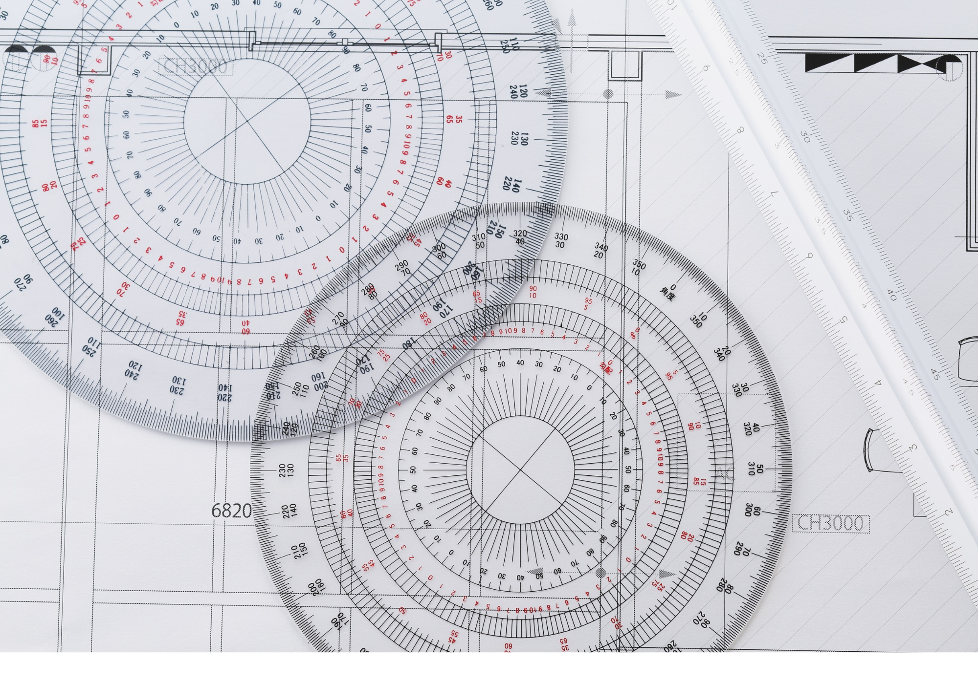 Drafting tools and architectural plans in a faded background, representing the technical precision Monica O'Keefe brings to listing and marketing homes from Gwinnett to South Carolina.