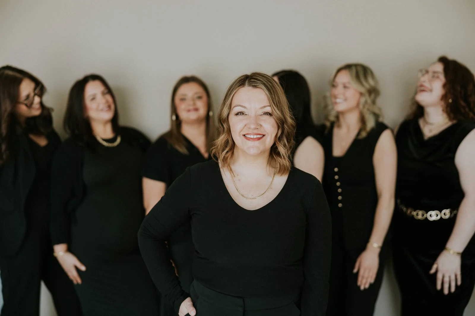 group photo of the all things new hair salon owner and stylist team