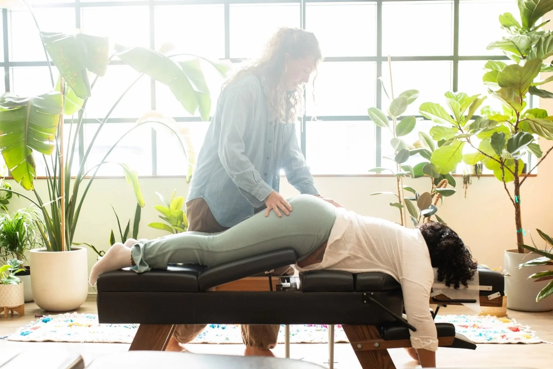 Dr. Taylor Meyers adjusting a pregnant patient at Withn Chiropractic and Wellness in North Loop, Minneapolis.