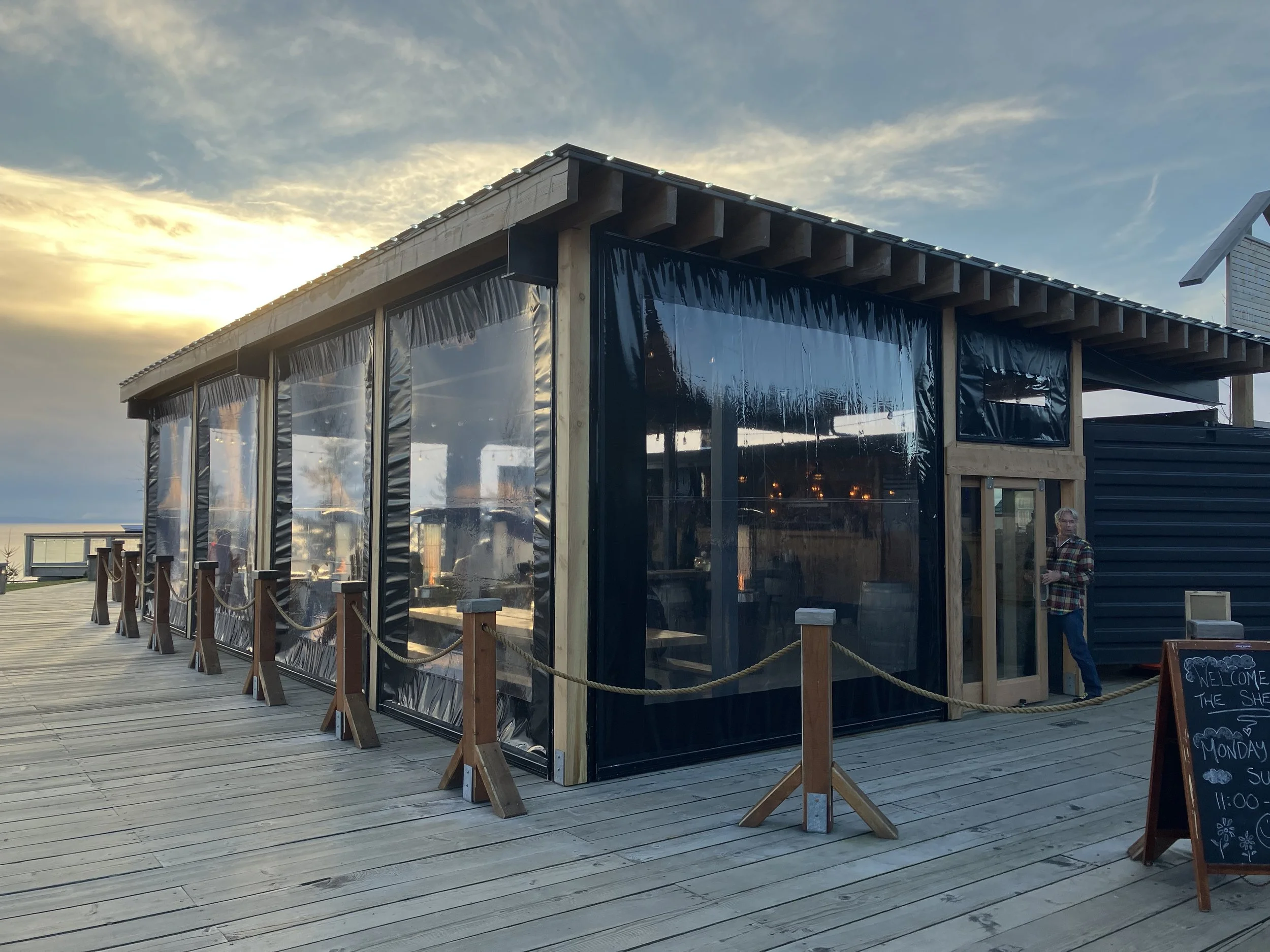 Modern restaurant interior at The Shed in British Columbia featuring custom wood finishes and open dining layout