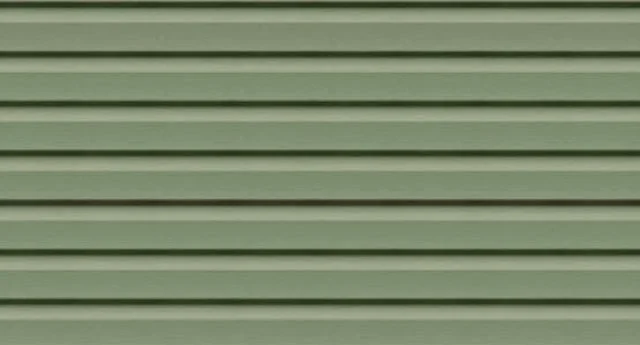 Close-up of green horizontal vinyl siding on a building exterior.