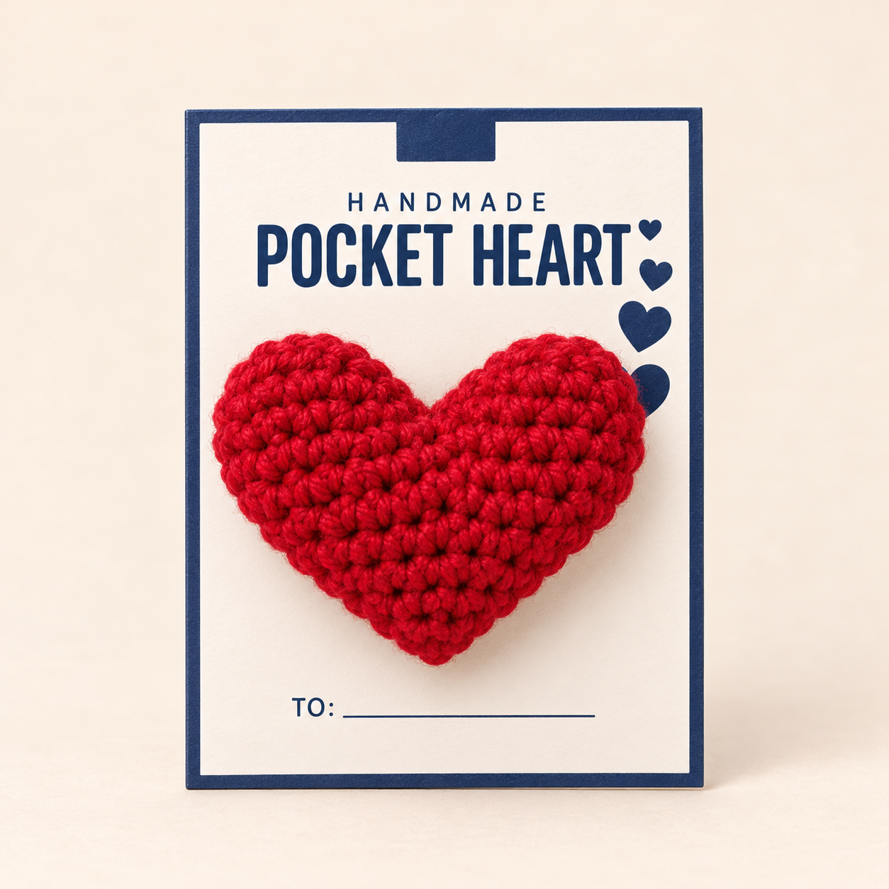 Red handmade Pocket Heart displayed on its card