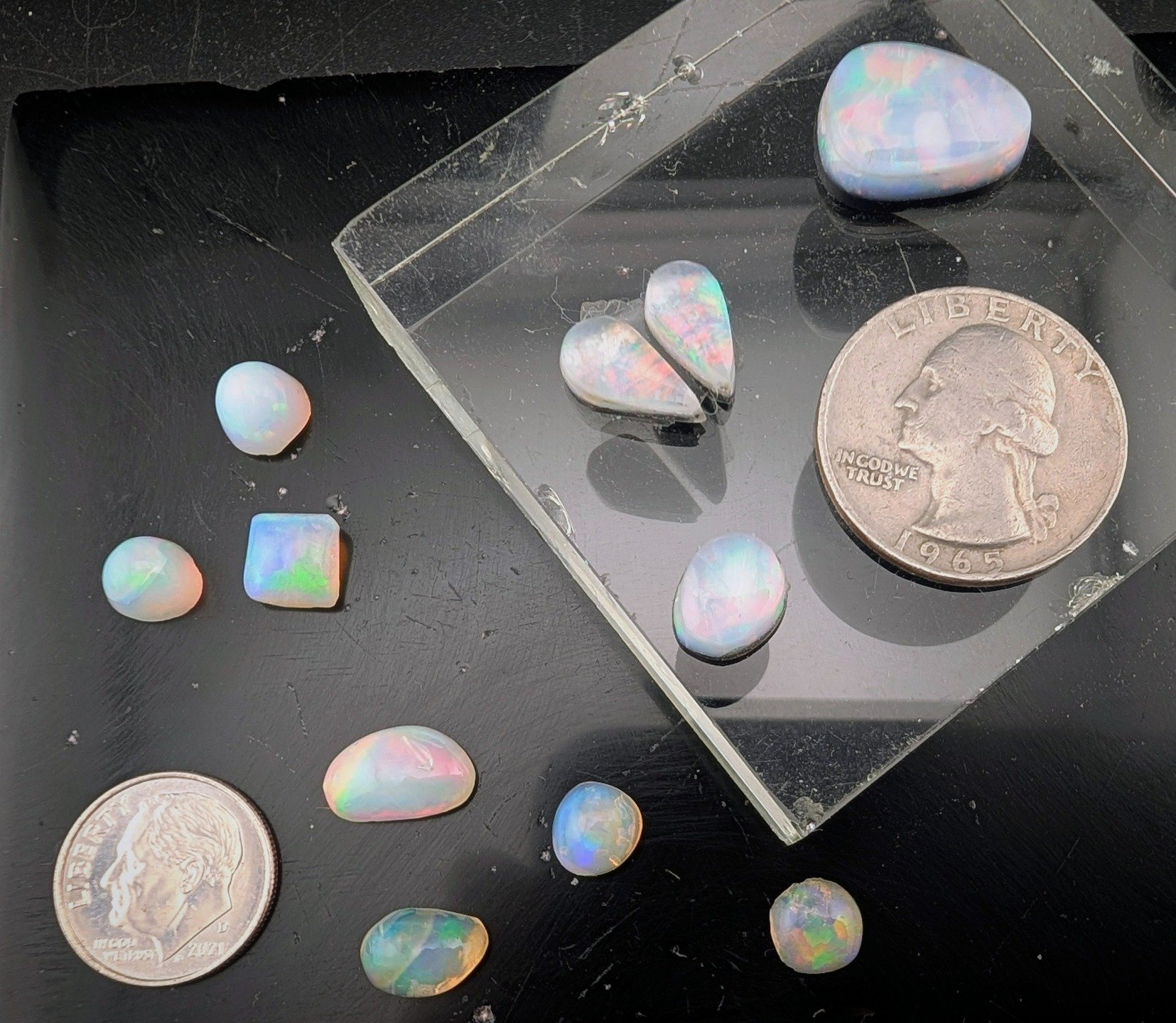 Something special to offer. An assortment of Opals. Ethiopian and Spencer Triplets. I don't do this very often, but I don't want them just hanging around. These are giveaway prices.

Spencer Opal Triplets:
Number 1 - 3.3 carets for $35
Number 2 - 5.7