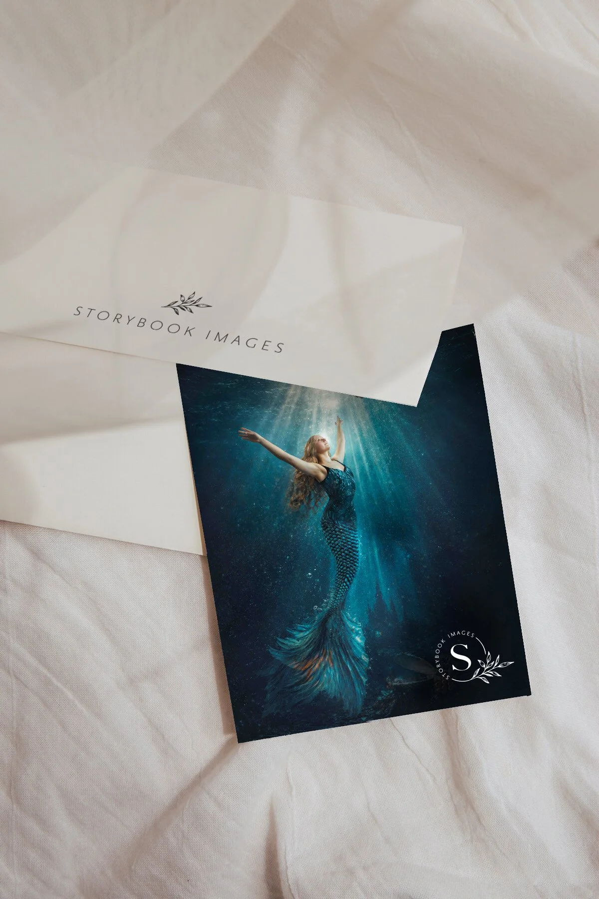 The elegant Storybook Images logo is displayed on a photo and a paper.