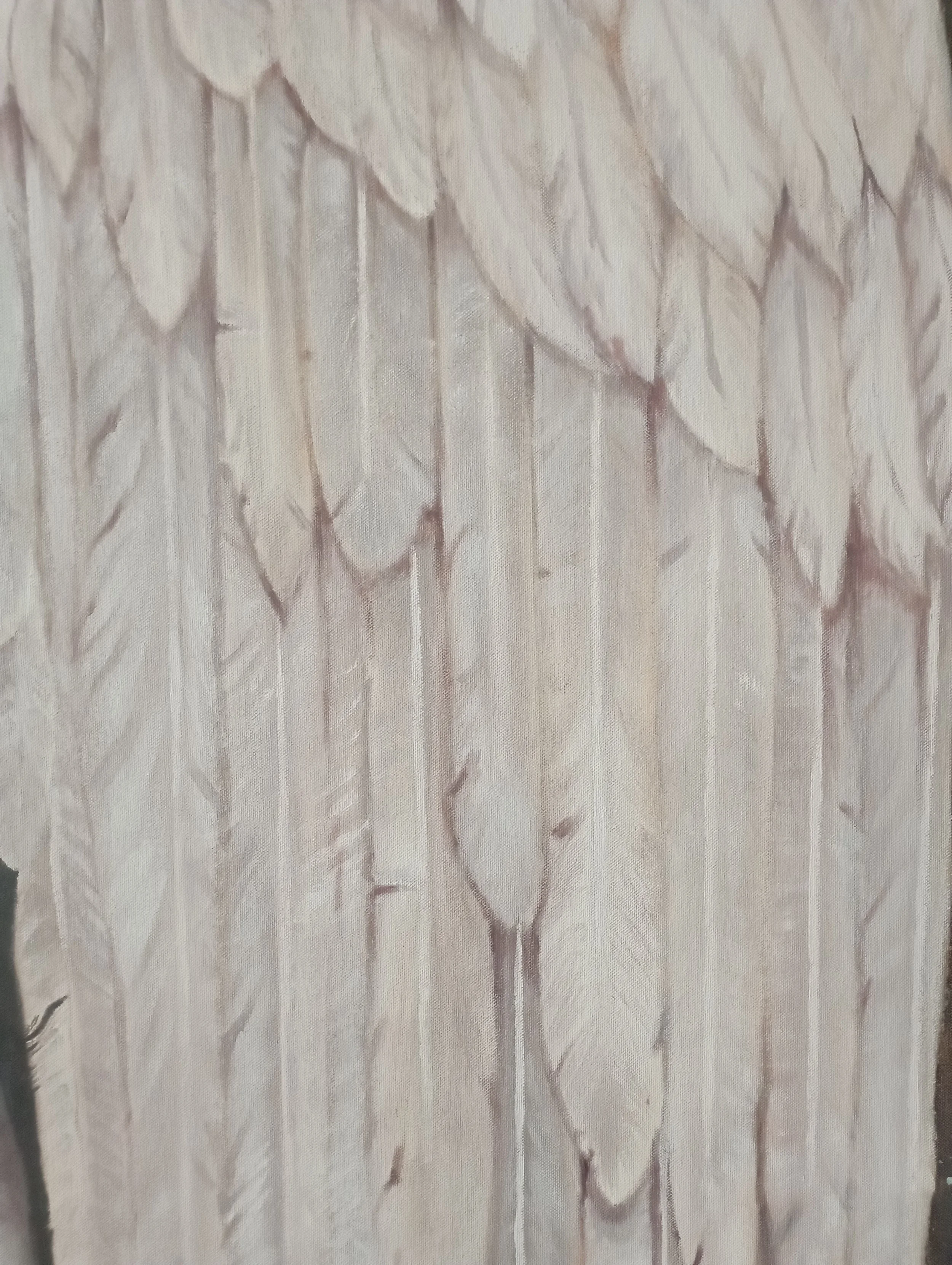 Close-up of a wooden surface with a carved leafy pattern.