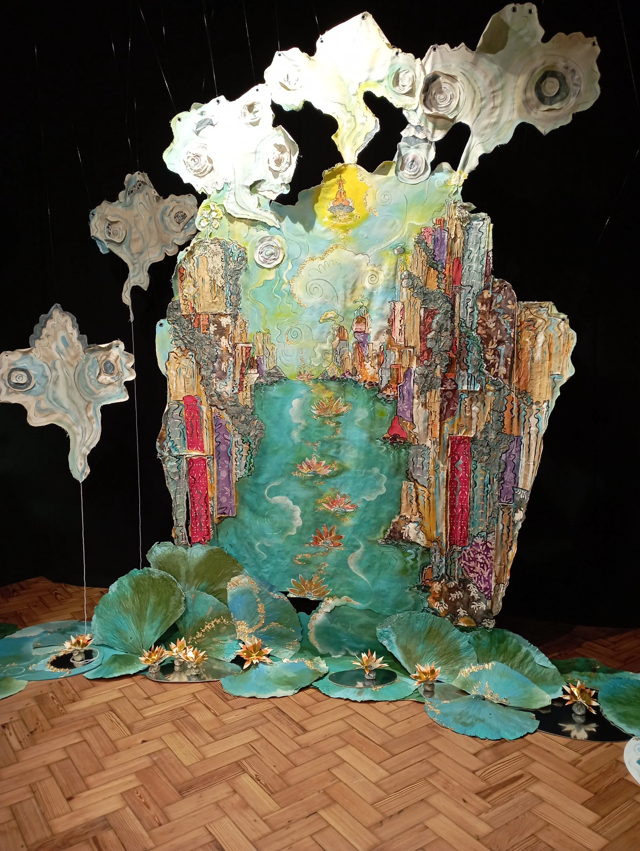 Canvas, joss paper, fabric and dried lotus leaves combine to create the ultimate destination.