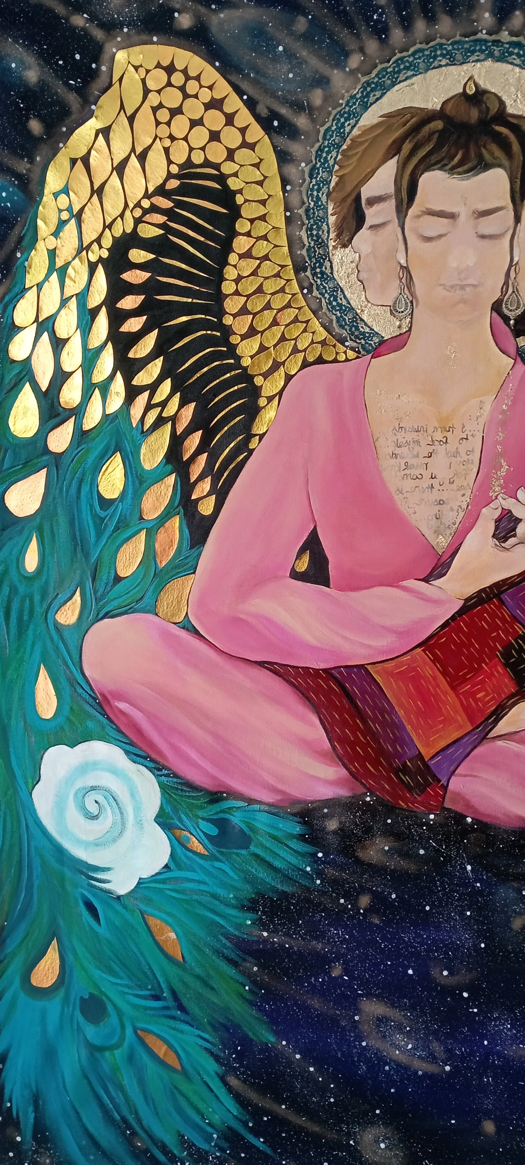 A colorful painting of a woman with twin faces, pink clothing, sitting cross-legged, surrounded by artistic and cosmic elements, with a wing and a tree blending into a cosmic background.