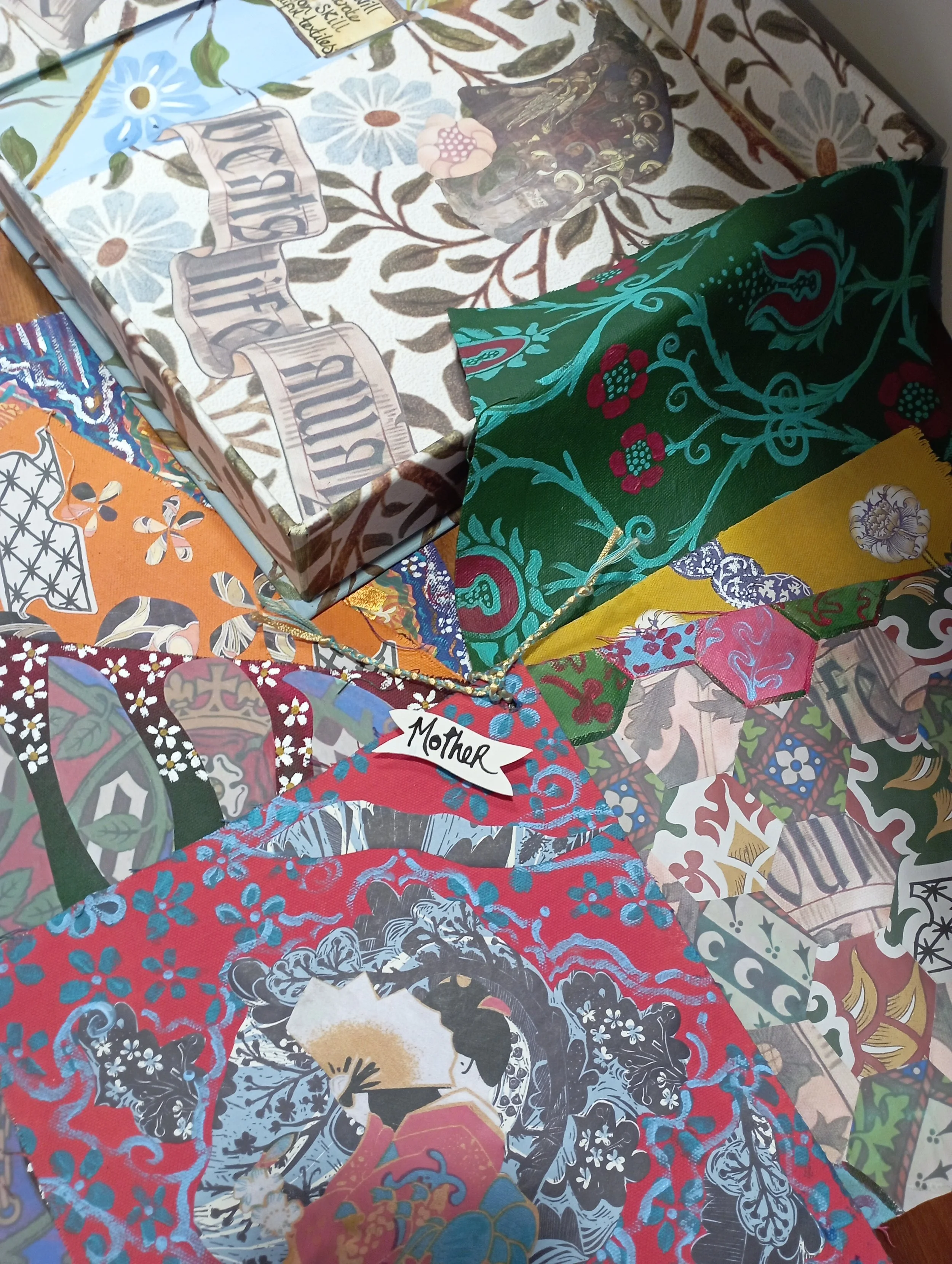 Decorative collage with various paper patterns and a box with the words 'Best Mum Ever' on the lid.