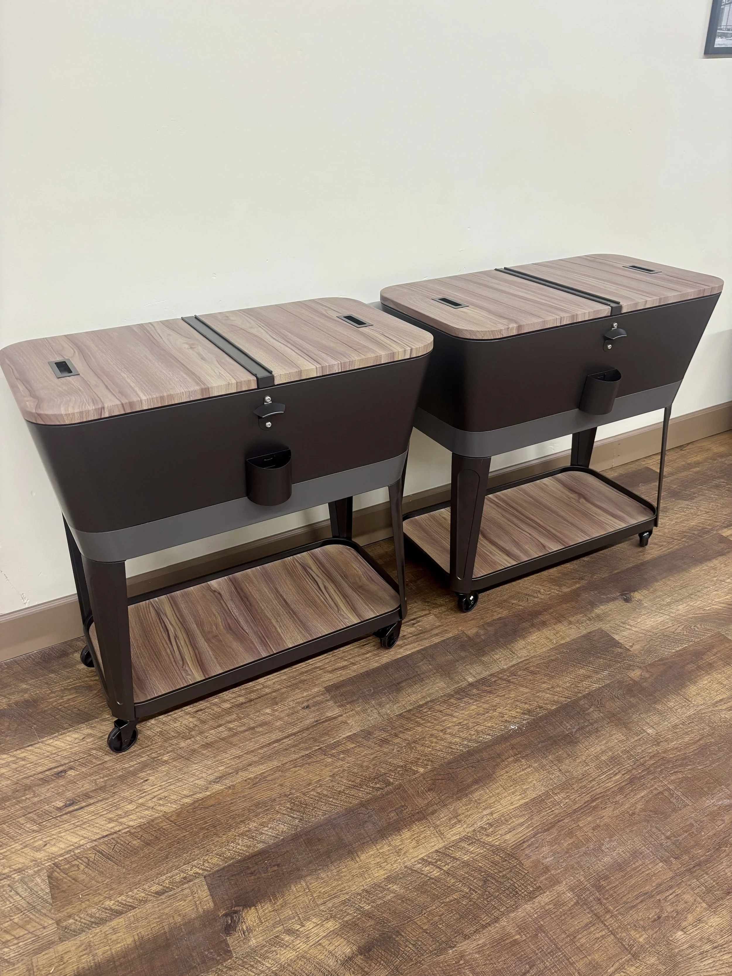Two modern portable coolers with close lids and wheels to be used with your rental.