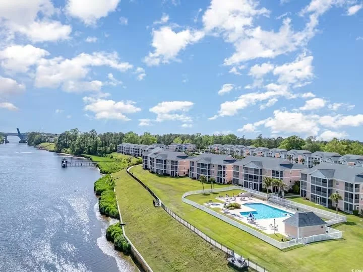 Aerial view of Waterway Village Condos, a Myrtle Beach SC rental community with riverfront setting, swimming pool, and landscaped grounds.