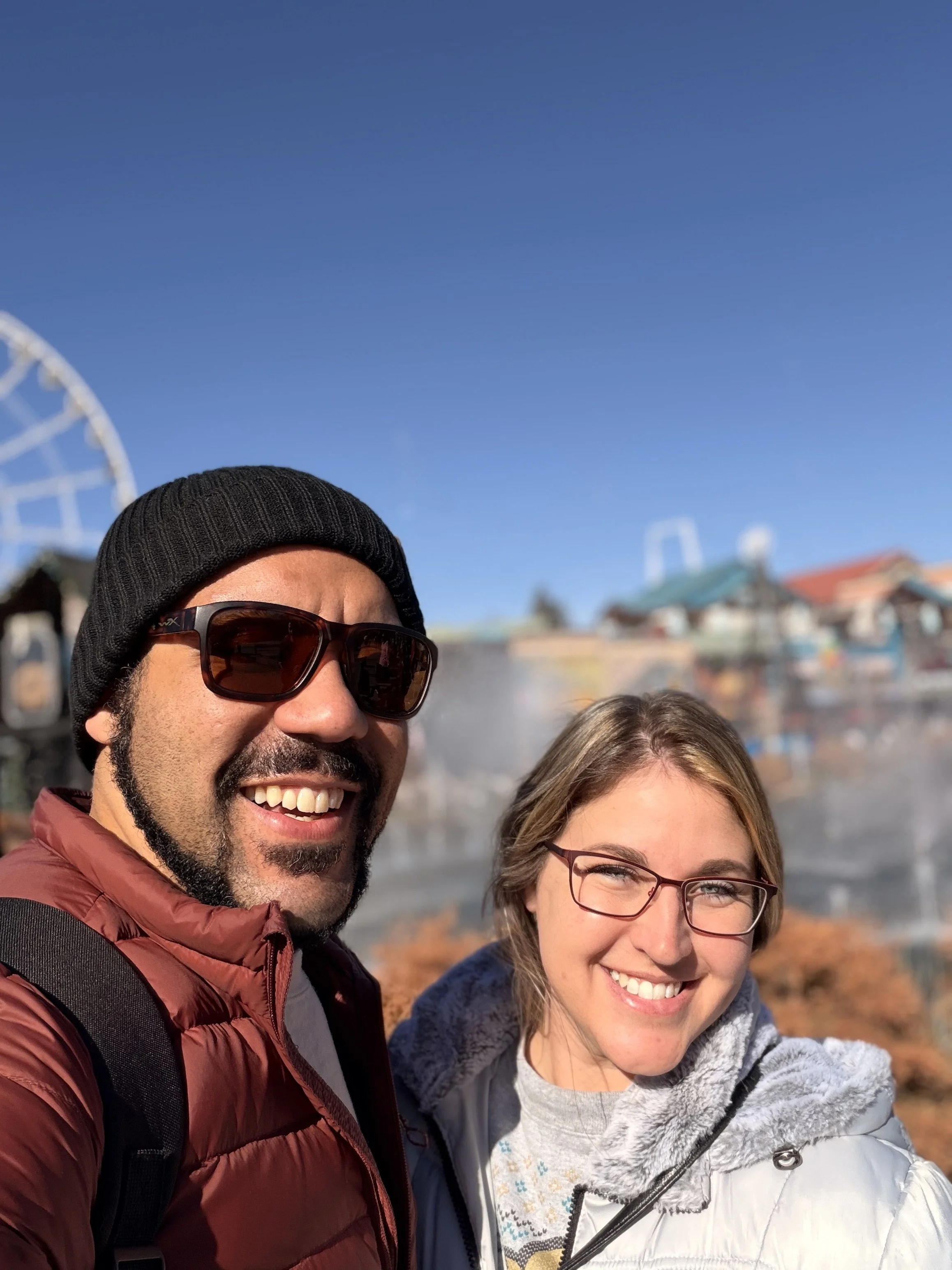Elizabeth Muckensturm and Roca Williams of Full Moon Travelers smiling outdoors in Myrtle Beach, SC on a clear day.