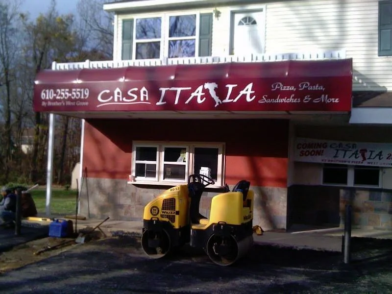 Exterior of Casa Italia restaurant with construction equipment in front