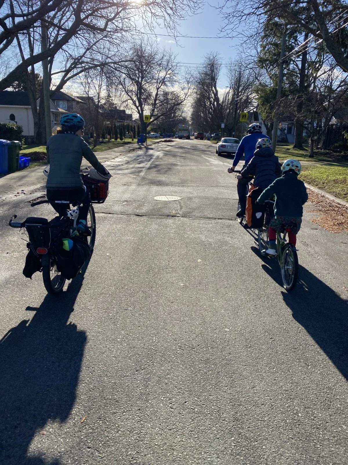 view of cyclists in a sunny street