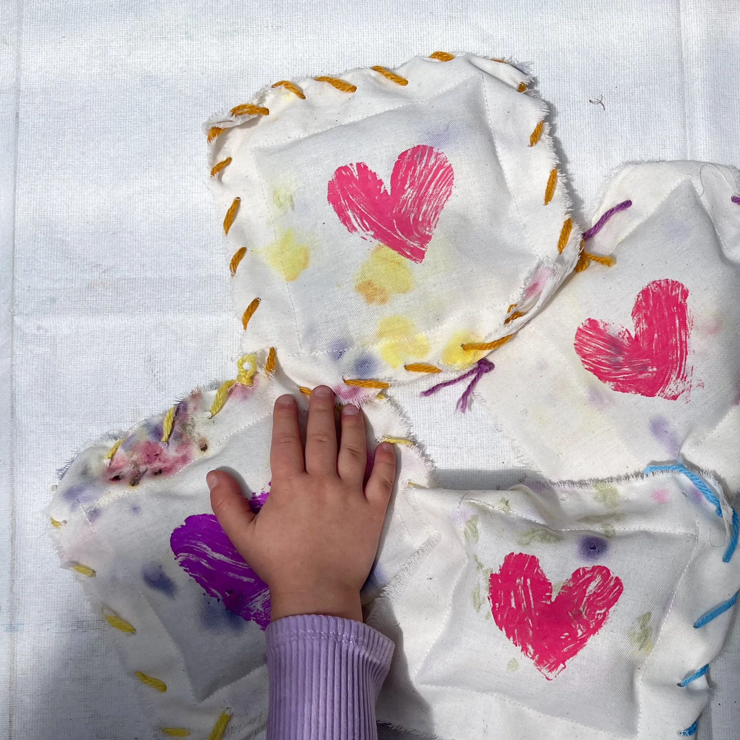 Lavender sachets with our hammered botanical textiles and a monoprint heart. 🪻🪡 The kids were introduced to both hand sewing (with yarn around the edges) and machine sewing (operating the pedal on a vintage Singer) on this one. Stuffed with fluff a