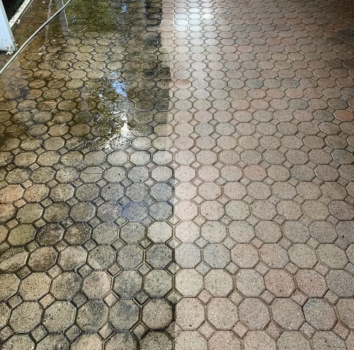 Comparison of dirty and clean sidewalk sections with hexagonal paving tiles.