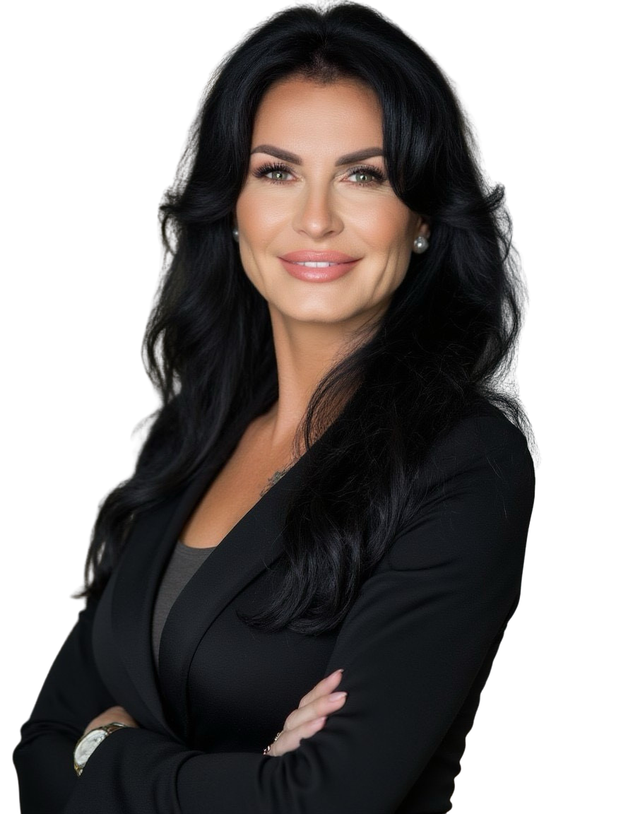 A woman with long black hair wearing a black blazer and pearl earrings, smiling confidently.