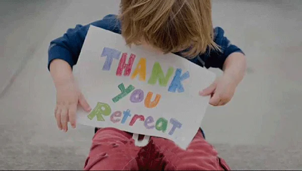 Little-Boy-with-Retreat-Sign.jpg