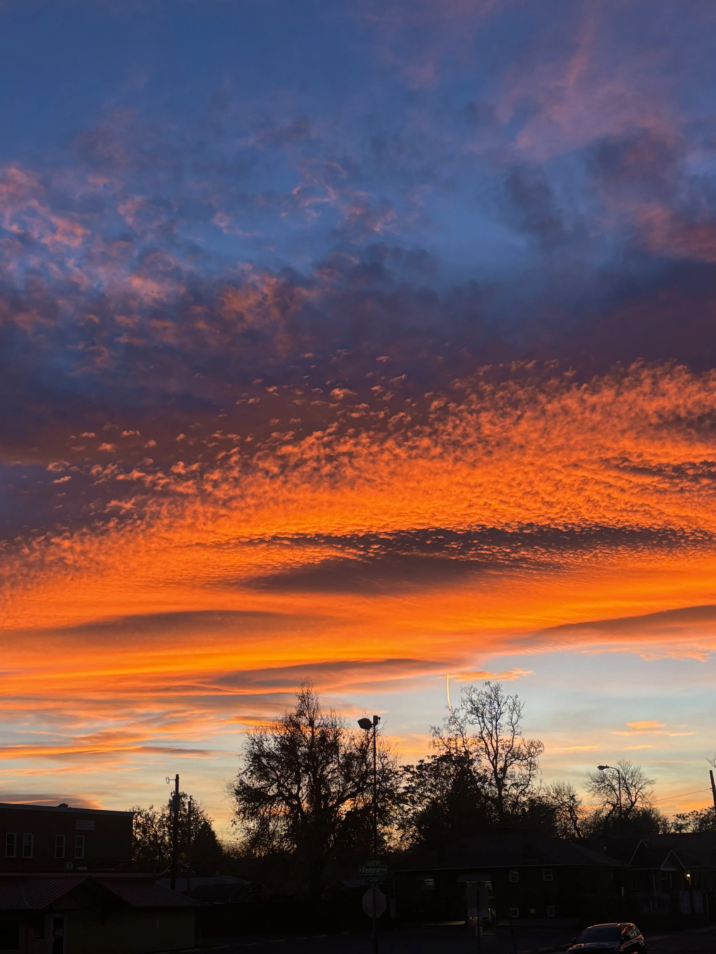 Orange sunset over the Sunnyside neighborhood in Denver, CO