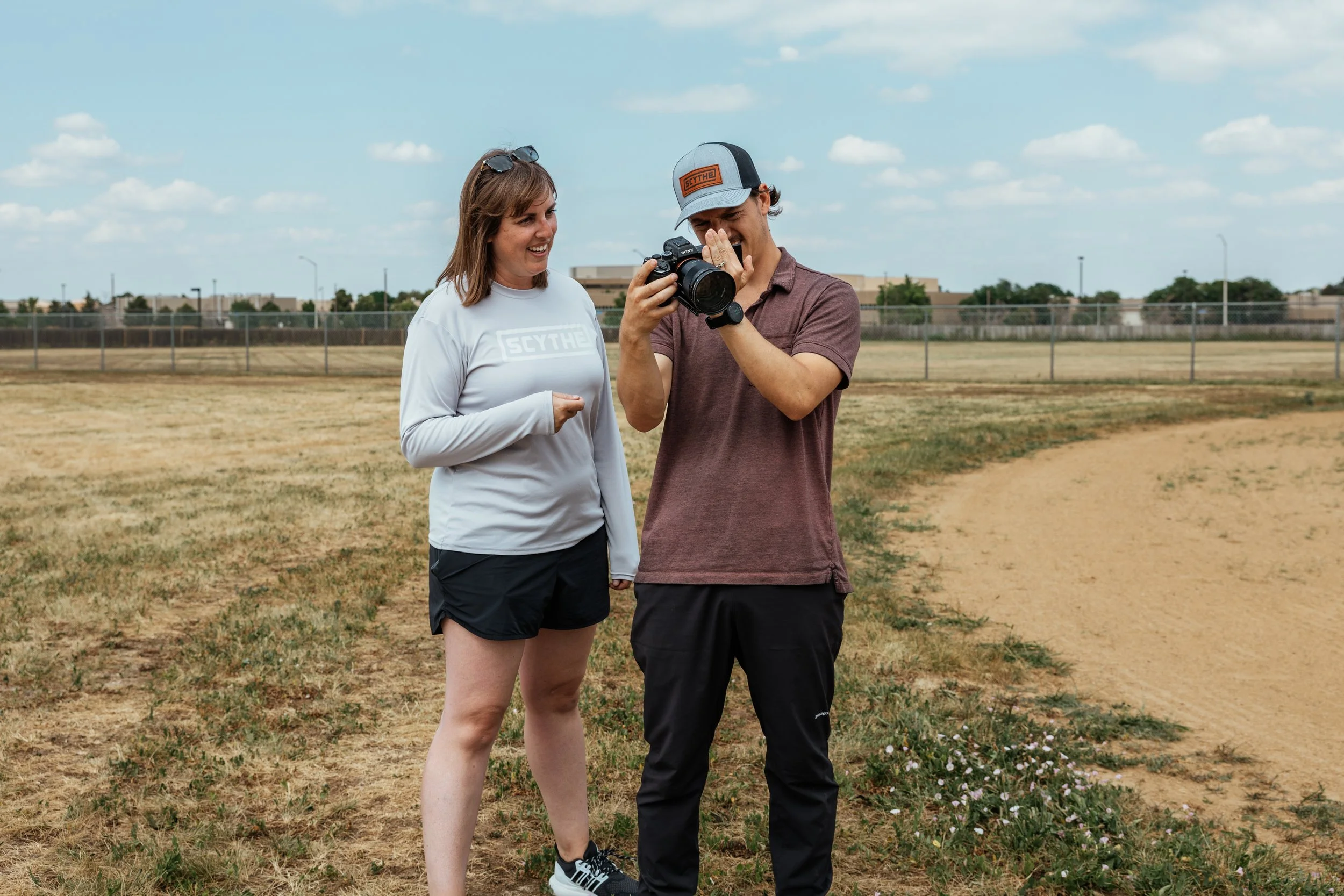 commercial directo Roo Smith showing a client photos on a camera