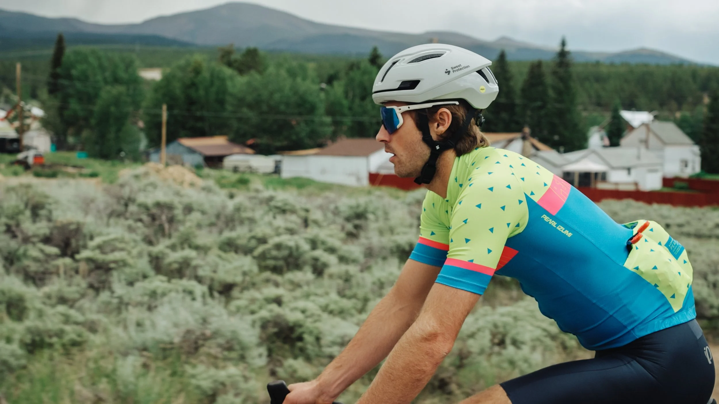 a cyclist on a bike ride in a mountain town