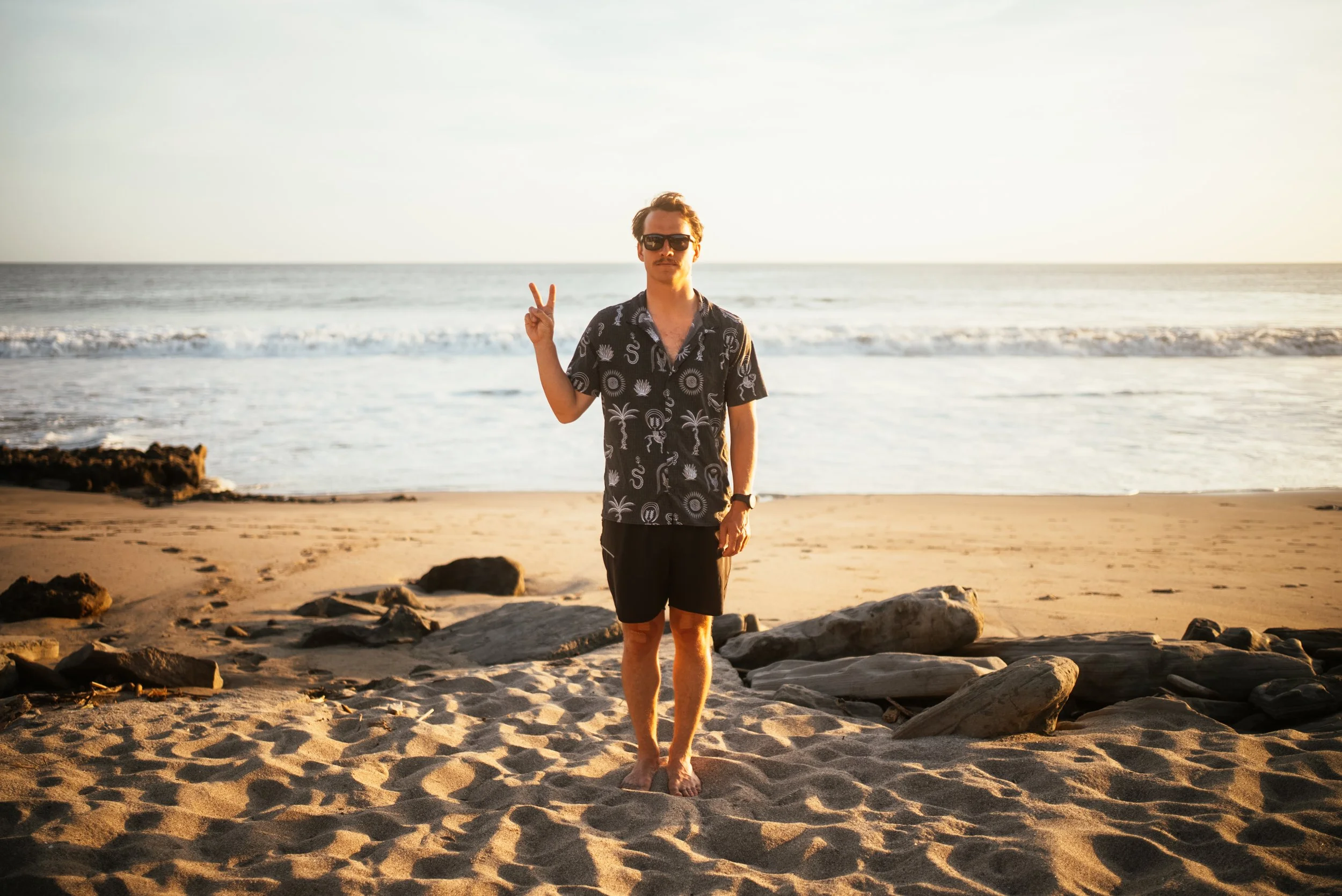 Roo Smith on beach in cool shirt
