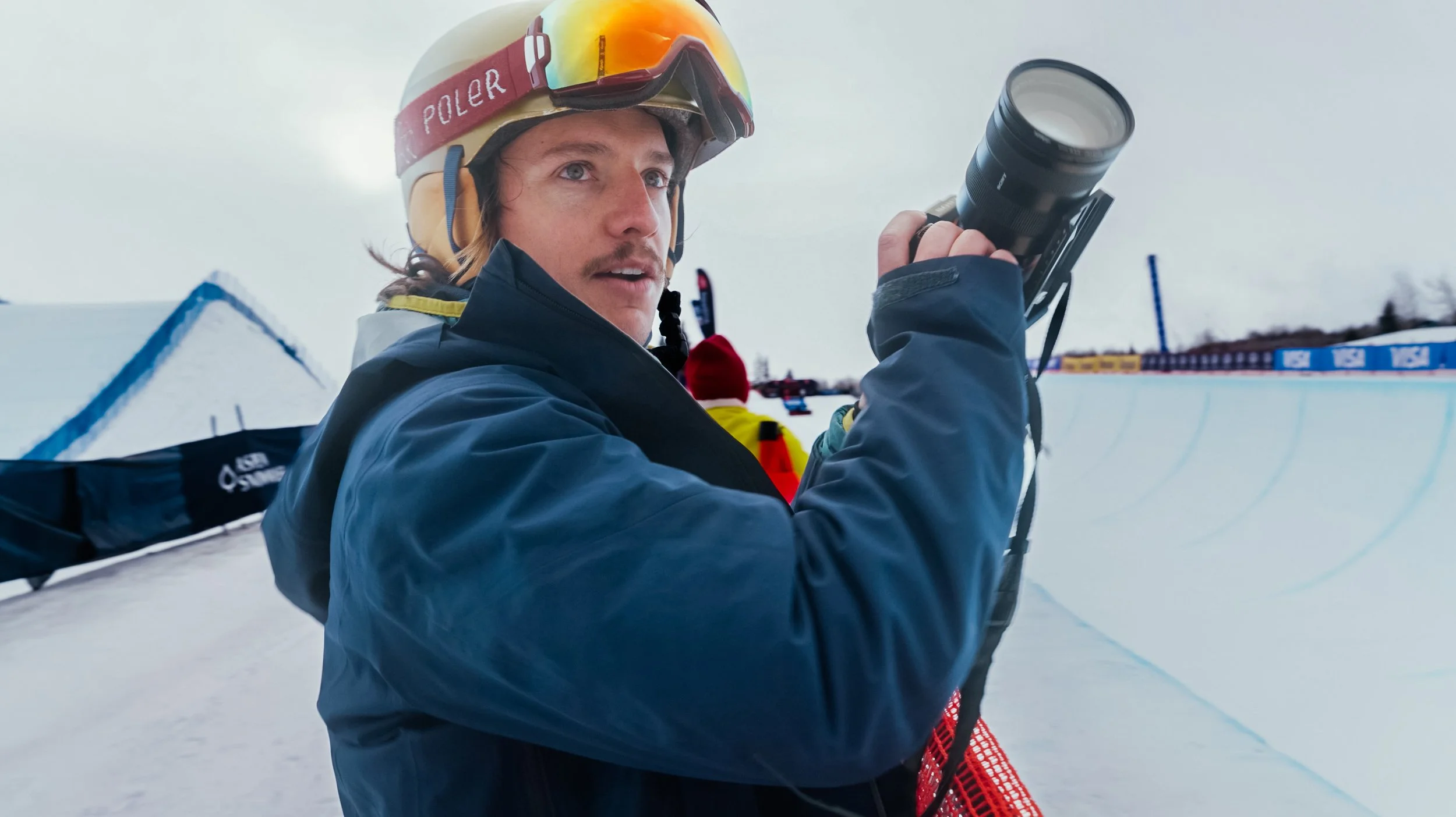 Adventure filmmaker Roo Smith holding his camera above his halfpipe at the U.S. Olympic Qualifiers