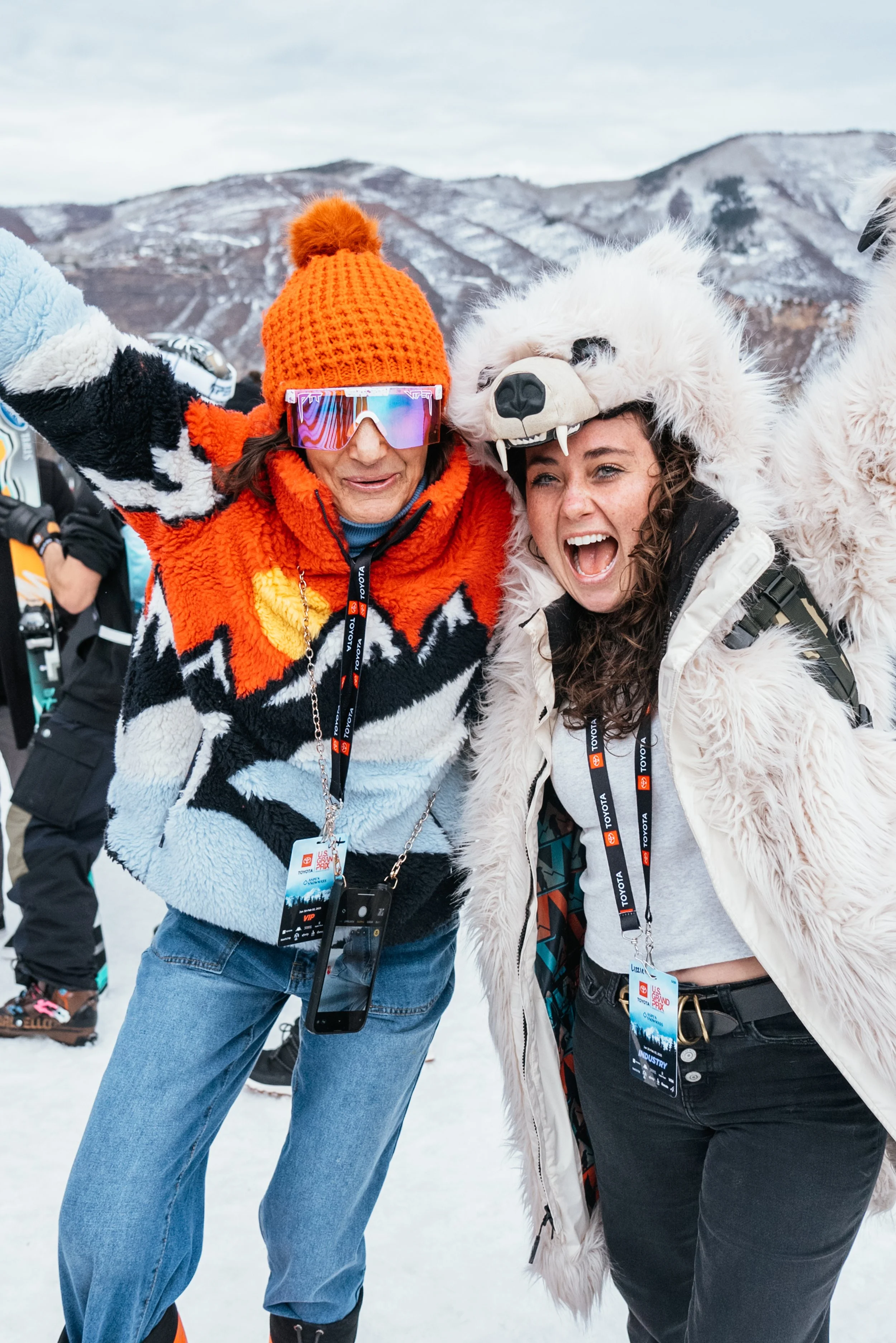 Two enthusiastic fans bringing the stoke at the bottom of the halfpipe