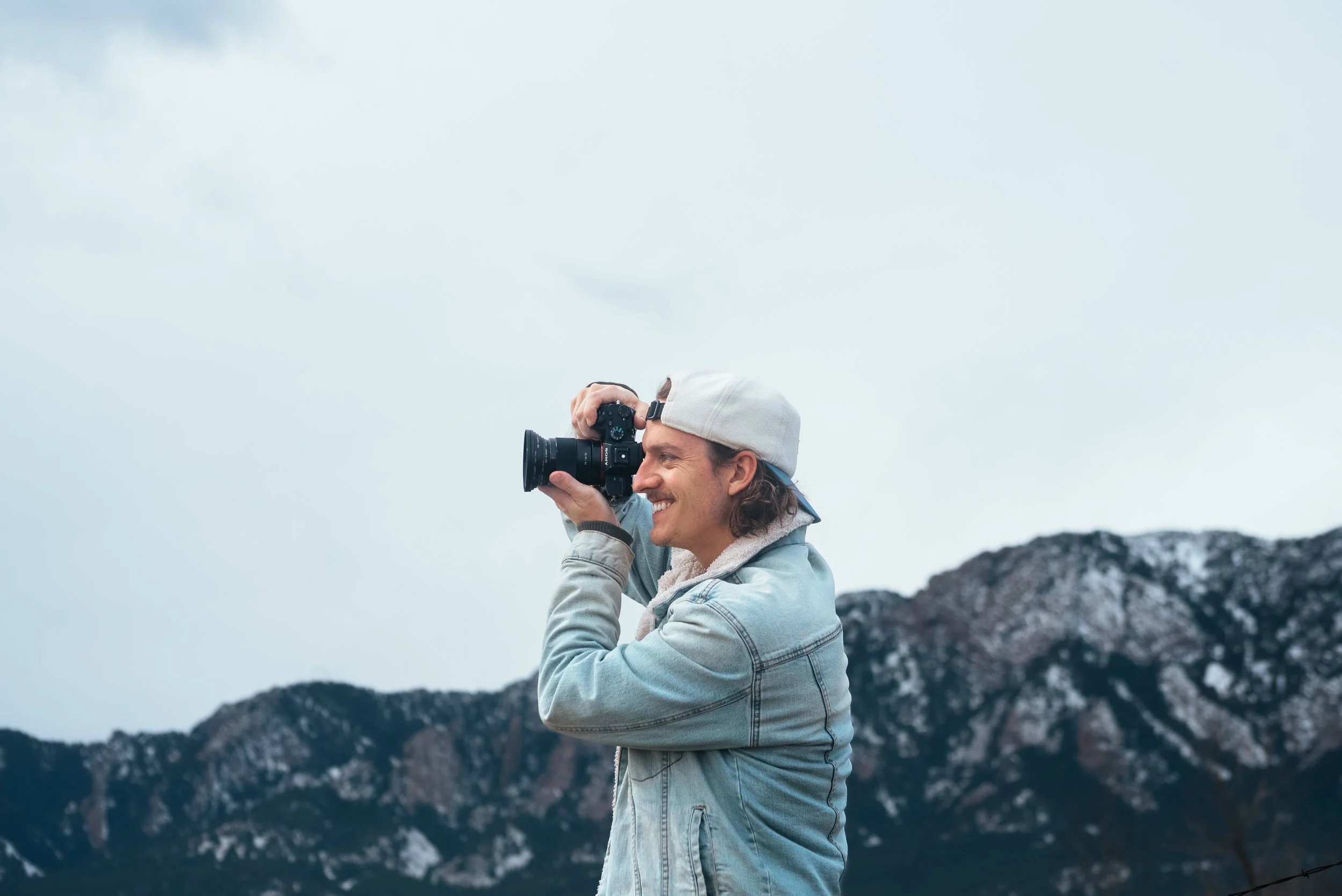 Adventure filmmaker Roo Smith taking a photo of Colorado