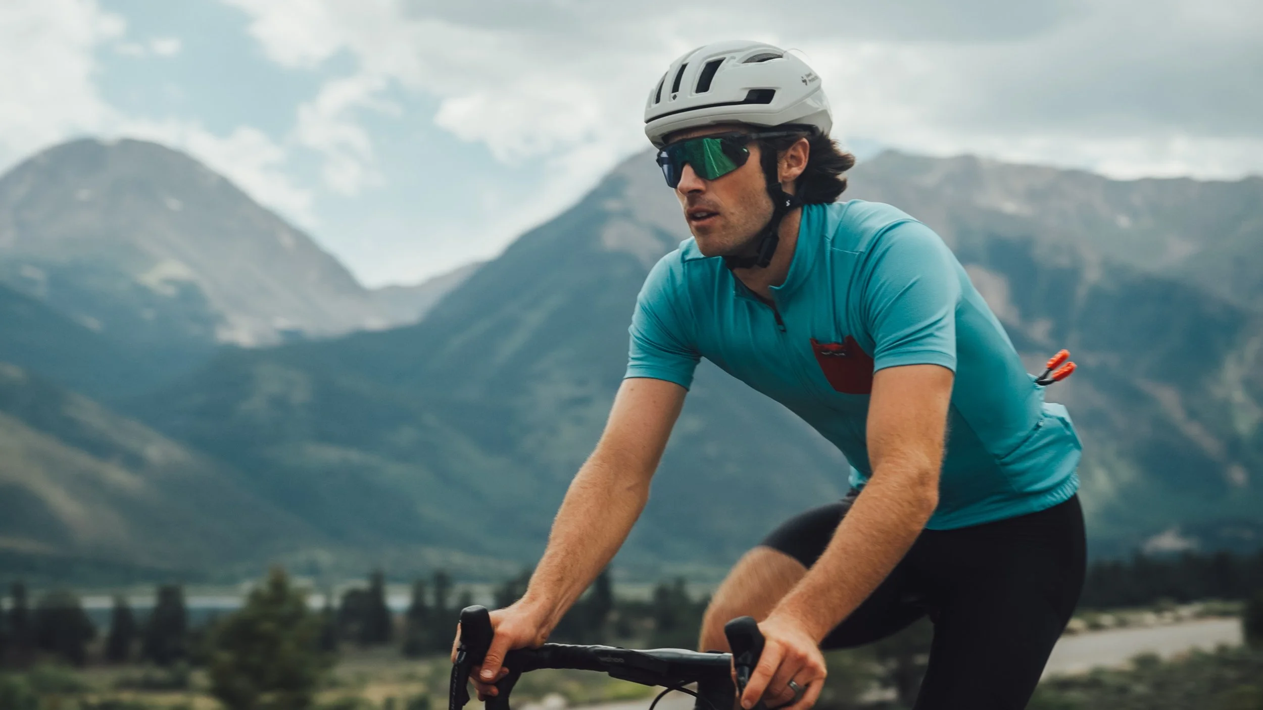 cyclist with mountains in the background