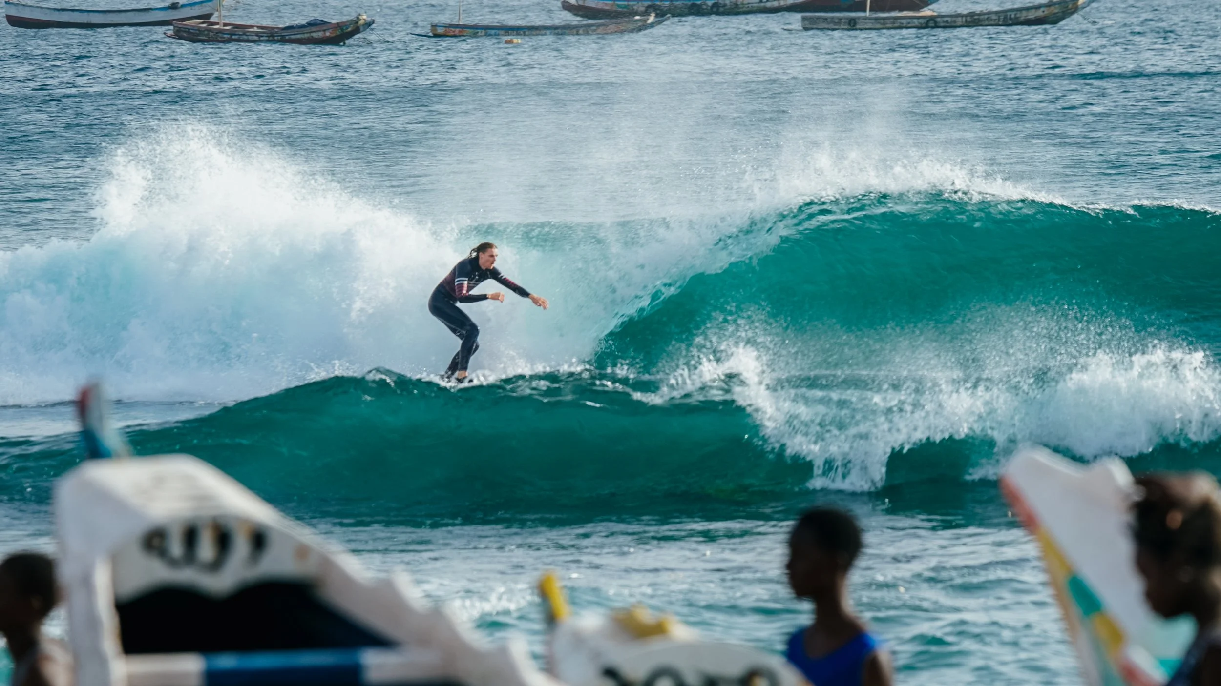 man surfing in senegal with barreling wave